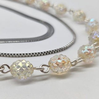 Necklace with lucite beads on a white background
