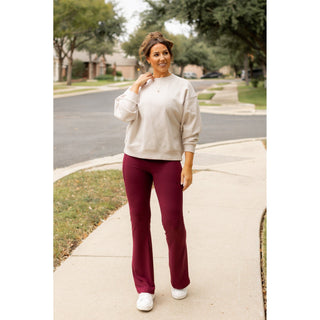High-waisted maroon bootcut leggings with pockets by Julia Rose, Julia Rose womenâ€™s maroon flared leggings lifestyle image