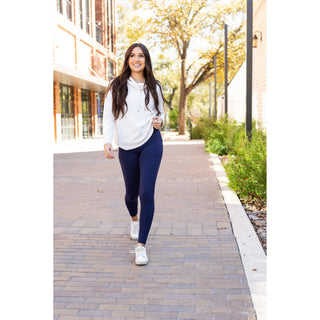 High-waisted navy crossover leggings with pockets by Julia Rose, Julia Rose womenâ€™s navy full length leggings lifestyle image