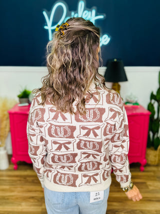 Rowan Horseshoe & Bow Sweater