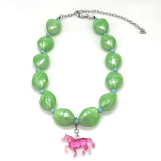 Necklace with green beads and a pink horse charm on a white background