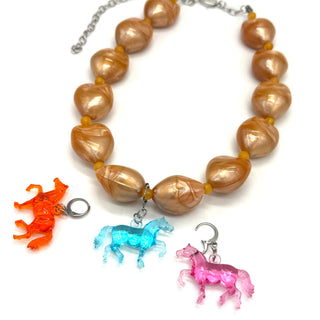 Necklace with horse-shaped charms on a white background