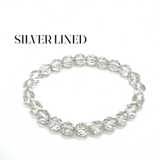 Silver beaded bracelet on a white background with 'SILVER LINED' text.