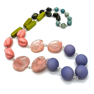 Necklace with multicolored beads on a white background