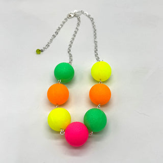 Neon-colored bead necklace on a white background