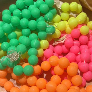 Neon colored vintage beads on strands