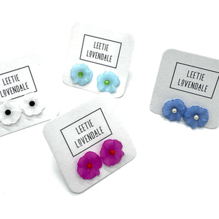 Floral earrings on display with 'Leetie Lovendale' branding.
