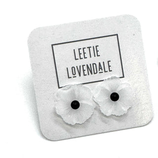 Flower-shaped earrings on a branded card with 'Leetie Lovendale' text.