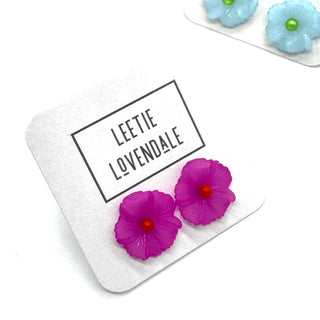 Pink flower earrings on a branded card with 'Leetie Lovendale' branding.