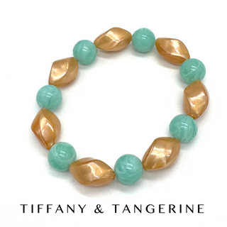 Bracelet with gold and turquoise beads on a white background, featuring 'Tiffany & Tangerine' branding.