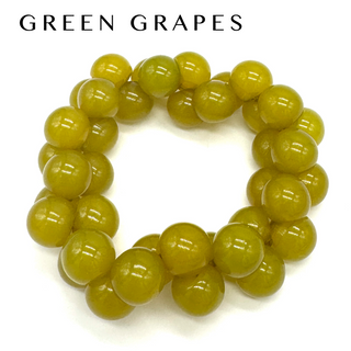 Green beaded bracelet on a white background with 'GREEN GRAPES' text above.
