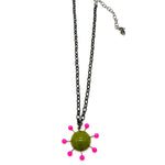 Olive green pendant with hot pink beads radiating around the center, reminiscent of the Sputnik satellite. Pendant hangs on an adjustable chain