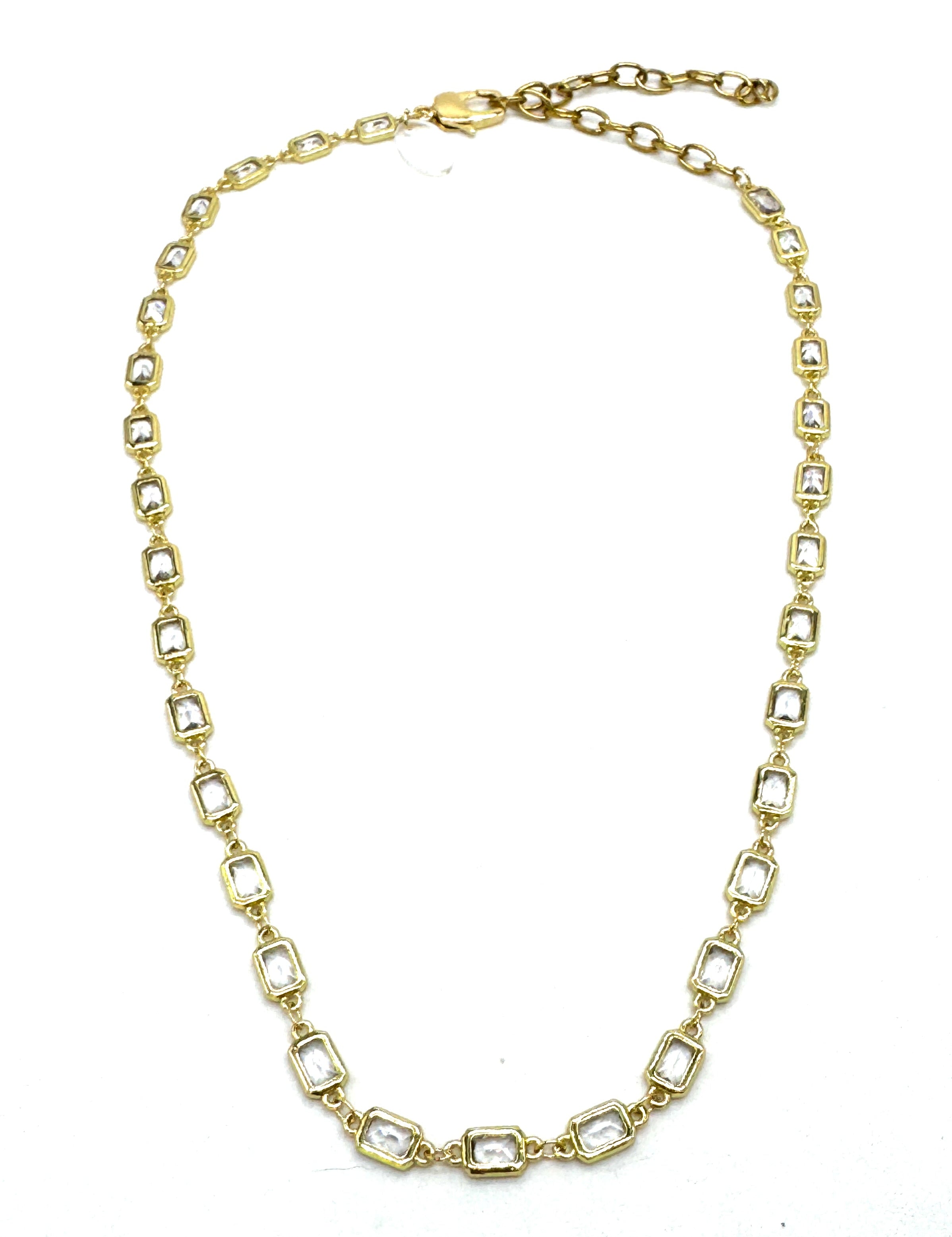 Gold chain necklace on a white background