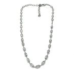Silver necklace with clear stones on a white background