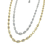 Two gold and silver necklaces with diamond-like stones on a white background