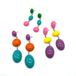Colorful beaded earrings on a white background