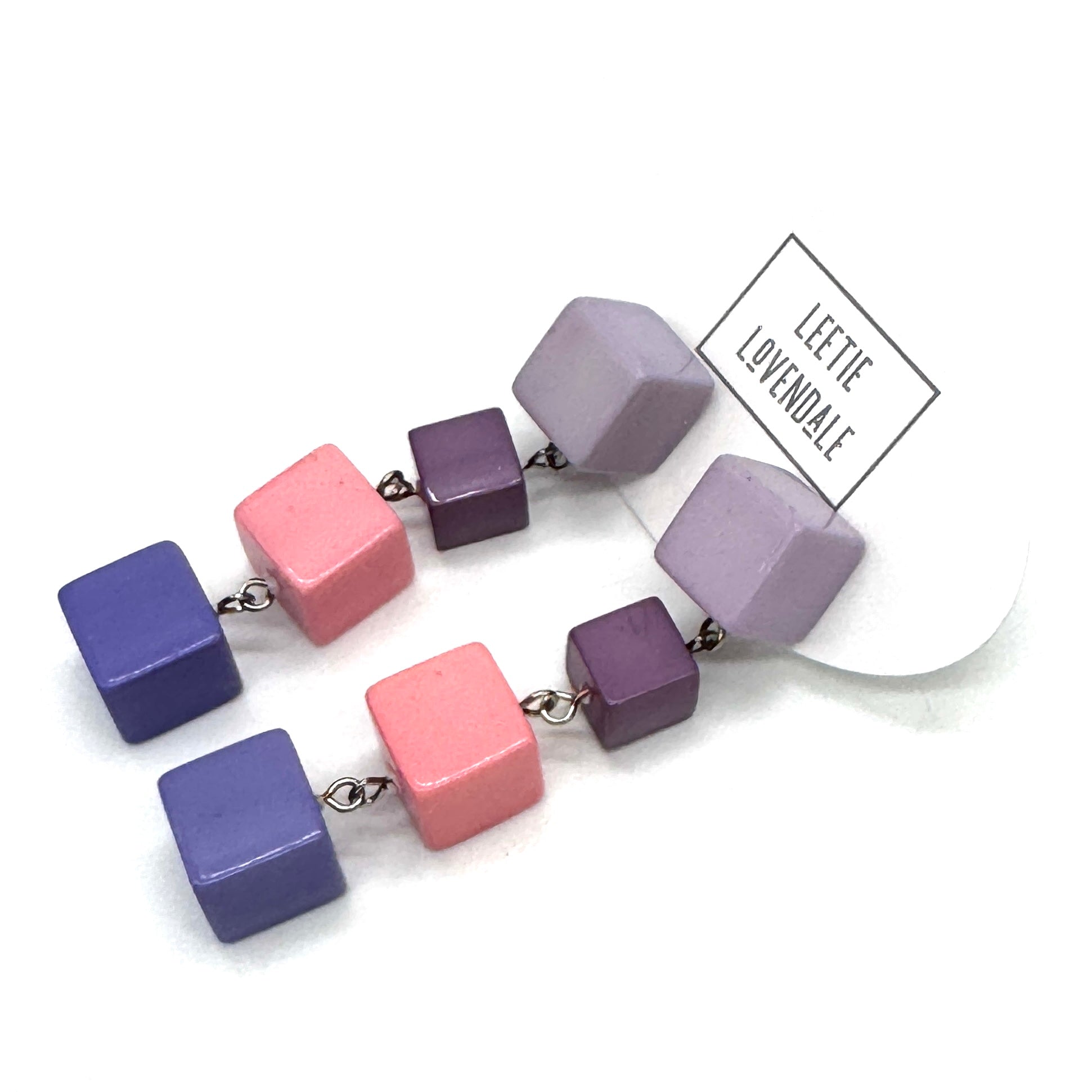 Colorful cube-shaped beaded earrings on a white background with 'Leetie Lovendale' branding.