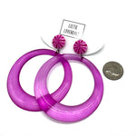 Purple hoop earrings with pink top parts on a white background, Leetie Lovendale brand visible.
