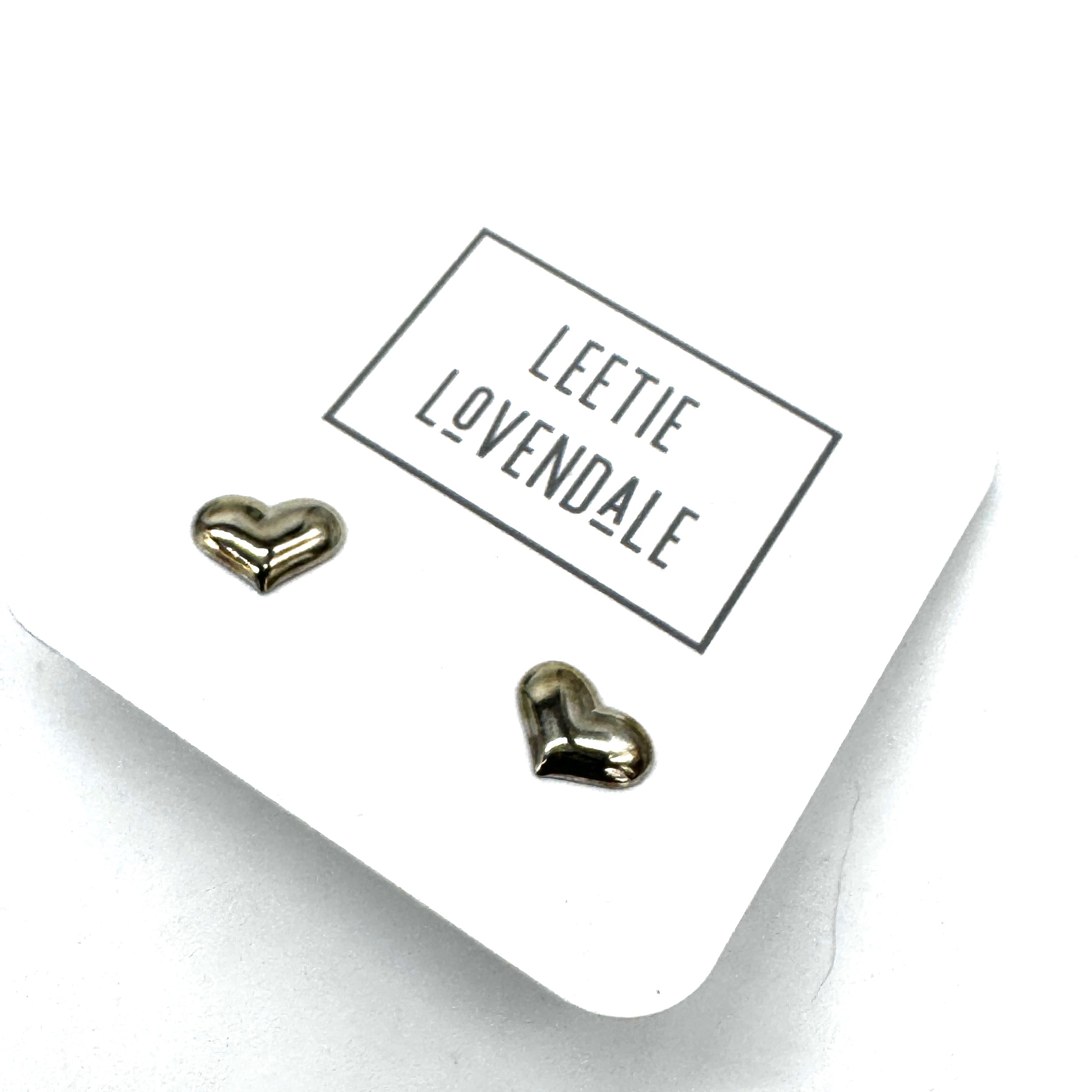 Heart-shaped earrings on a card with 'Leetie Lovendale' branding.