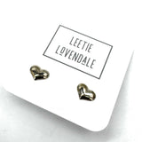 Heart-shaped earrings on a white card with 'Leetie Lovendale' branding.