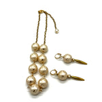 Half chain and half beaded necklace, featuring gold chain and floral etched pearl lucite beads, alongside matching dangle earrings.