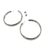 Large silver hoop earrings on a white background.