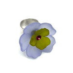 Periwinkle and olive green floral cocktail ring on a white background.