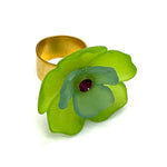 Lime and green floral cocktail ring on a white background.