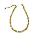 A gold-toned metal chain necklace with a lobster clasp and extender chain, displayed on a plain white background.