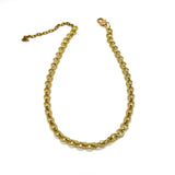 A gold-toned metal chain necklace with a lobster clasp and extender chain, displayed on a plain white background.
