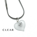 A silver snake chain necklace with a frosted clear heart-shaped pendant featuring a small silver heart in the center, shown on a white background with the word 'CLEAR' printed in the lower left.