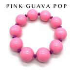 Pink beaded bracelet with purple accents on a white background, branded 'Pink Guava Pop'.