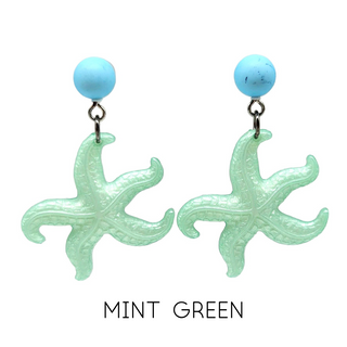 Mint green starfish earrings with turquoise beads on a white background