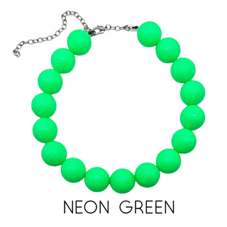 Neon green beaded bracelet on a white background with 'NEON GREEN' text.