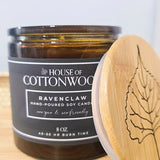 Candle with 'House of Cottonwood' label and bamboo lid