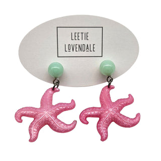 Pink starfish earrings on a white background with 'Leetie Lovendale' branding.